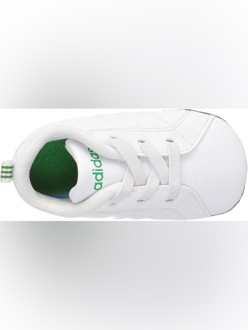 Adidas white crib shoes with green accents